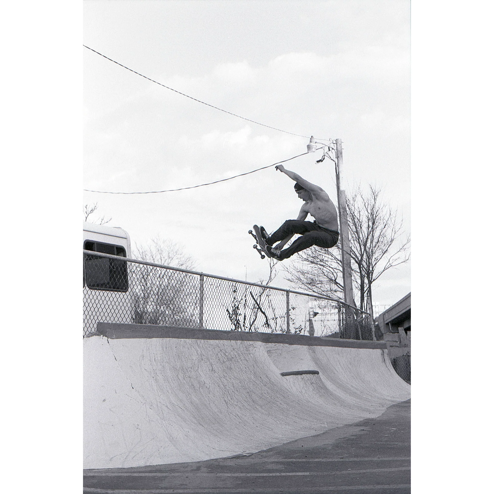 Black and White photo of local skater Felix Meyers getting big air on a quarter pipe. Photo by Dylan Shanahan.